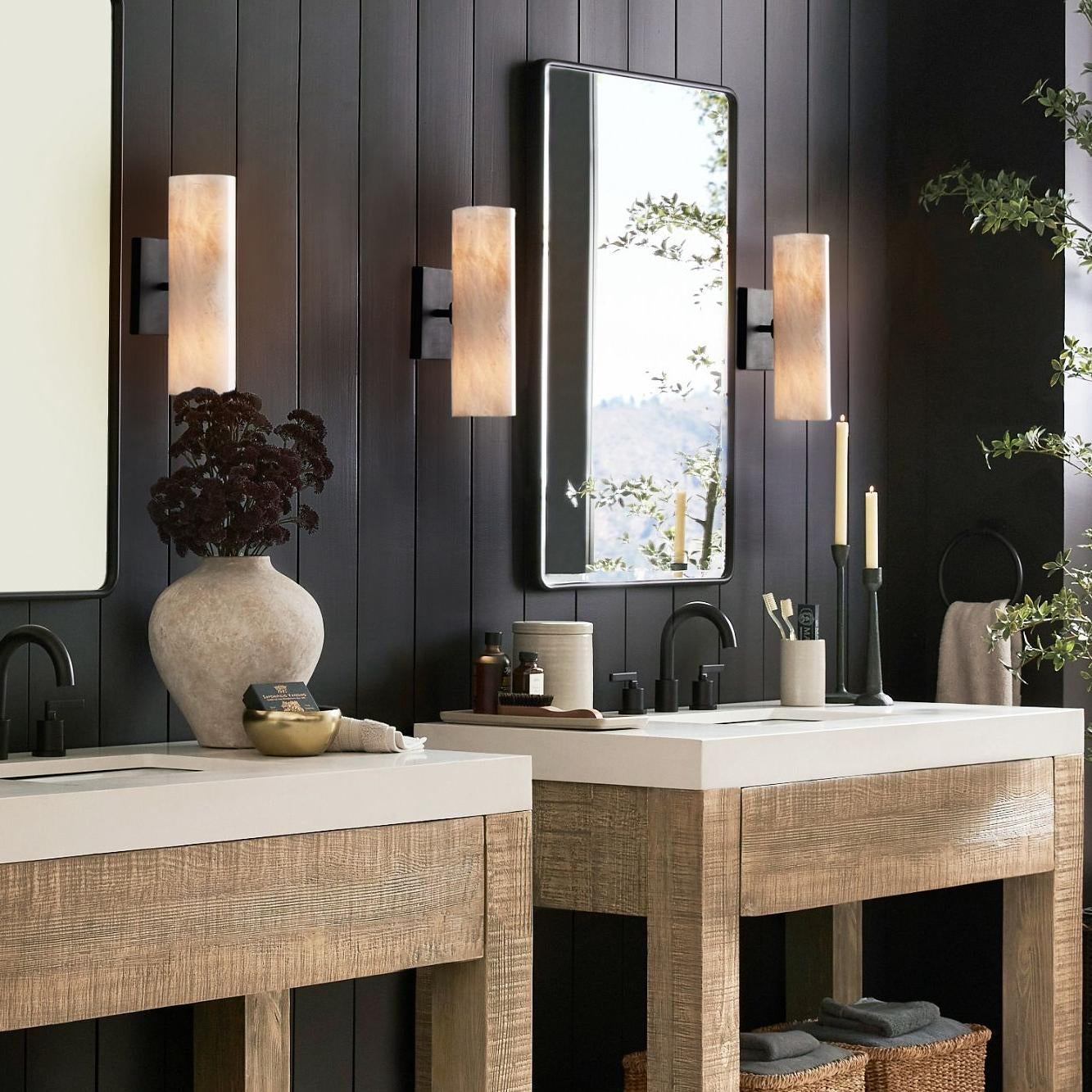 Doran sconce product detail with softly illuminated stone shade