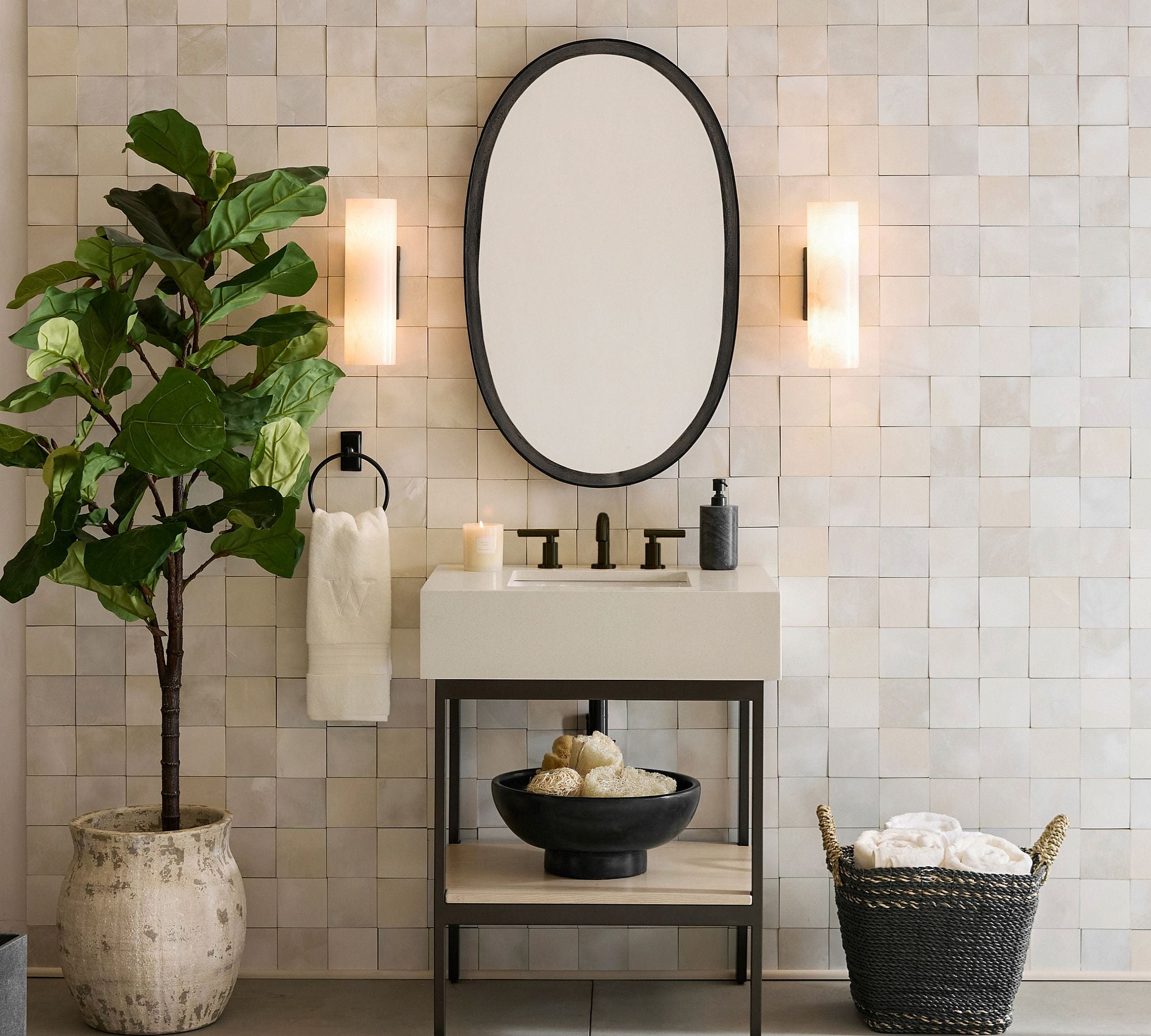 Doran alabaster tube sconce shown as a softly lit wall fixture